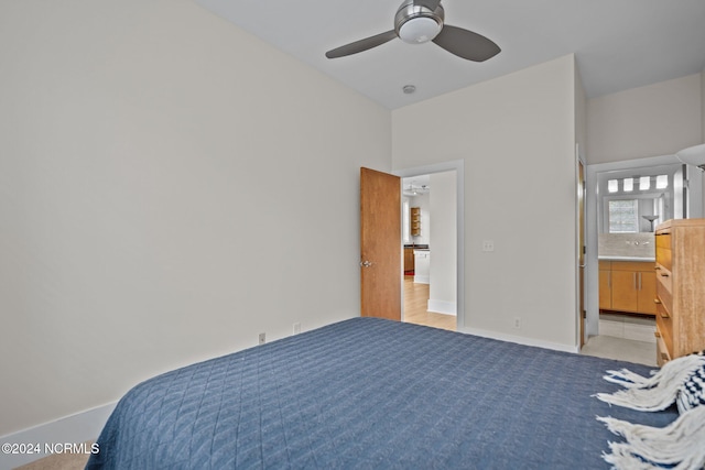 bedroom featuring ensuite bath and ceiling fan