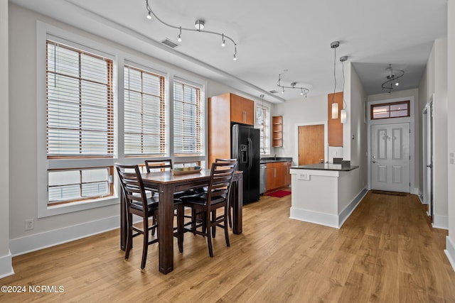 dining space featuring light hardwood / wood-style floors