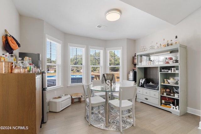 dining area with light wood-type flooring