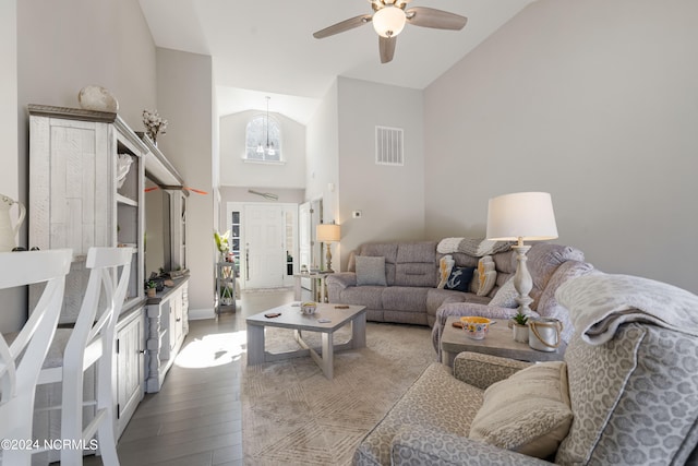 living room featuring hardwood / wood-style floors, high vaulted ceiling, and ceiling fan with notable chandelier