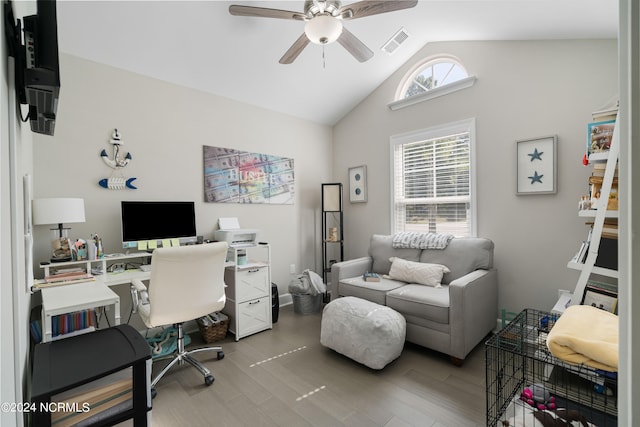 home office featuring lofted ceiling, hardwood / wood-style flooring, a healthy amount of sunlight, and ceiling fan