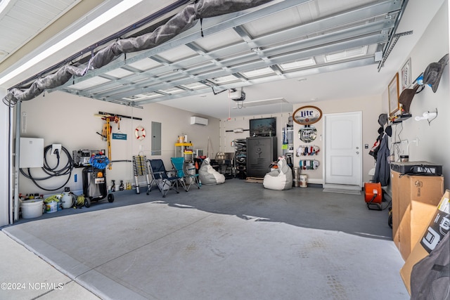 garage with electric panel and a wall unit AC