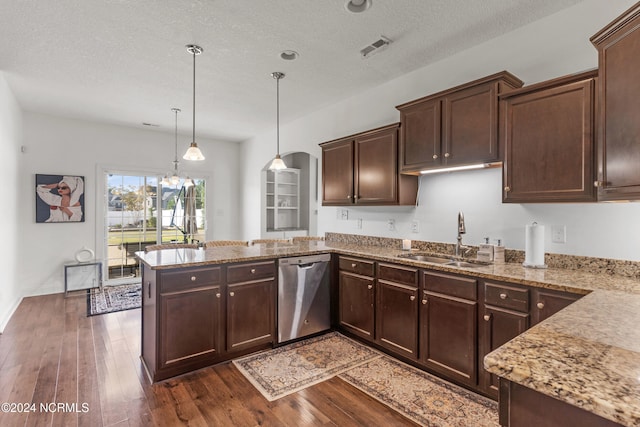 kitchen featuring sink, dishwasher, a textured ceiling, hanging light fixtures, and dark hardwood / wood-style floors