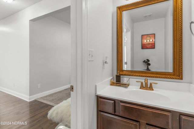 bathroom featuring vanity and hardwood / wood-style flooring