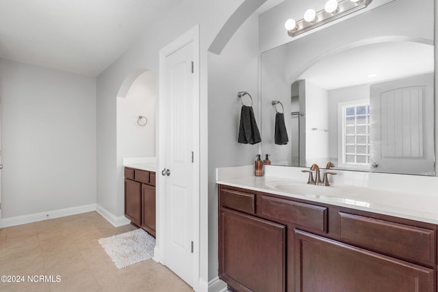 bathroom with vanity and tile patterned flooring