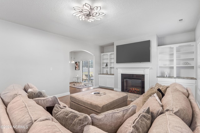 living room featuring a textured ceiling