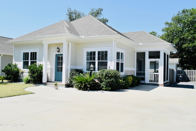 view of front of property featuring a sunroom