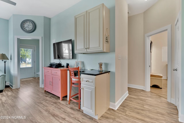 kitchen with cream cabinets and light hardwood / wood-style floors