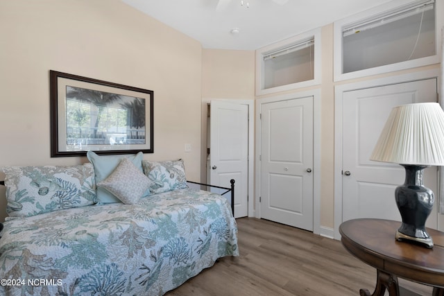 bedroom with hardwood / wood-style floors and ceiling fan