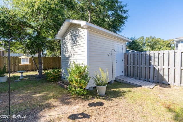 view of outdoor structure with a lawn