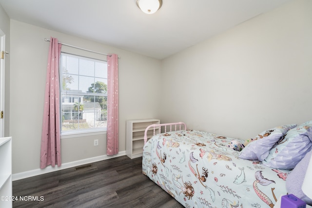 bedroom featuring dark wood-type flooring