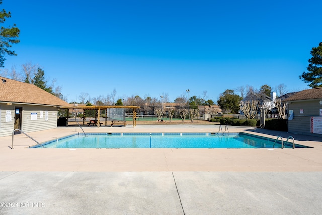 view of swimming pool with a patio area