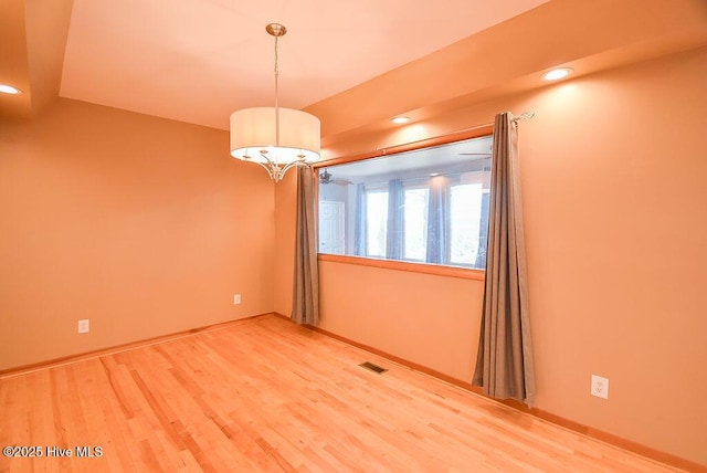 unfurnished room featuring hardwood / wood-style flooring