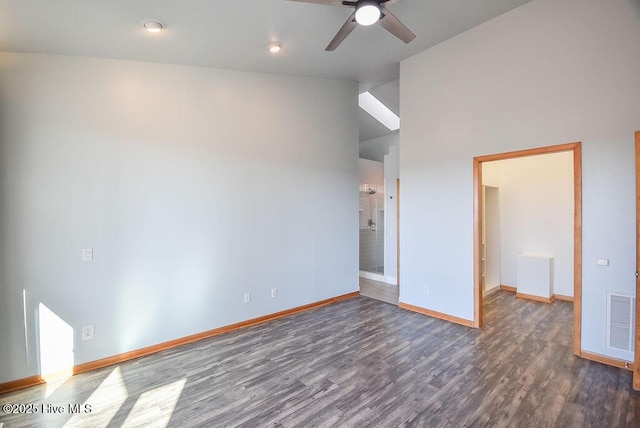 interior space featuring lofted ceiling, ceiling fan, and dark hardwood / wood-style floors