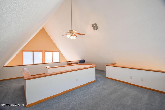 bonus room with ceiling fan, carpet, and a textured ceiling