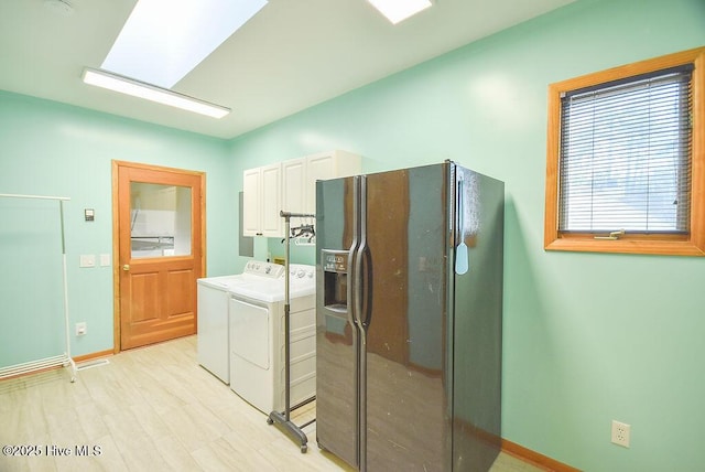 laundry area featuring cabinets and washer and clothes dryer