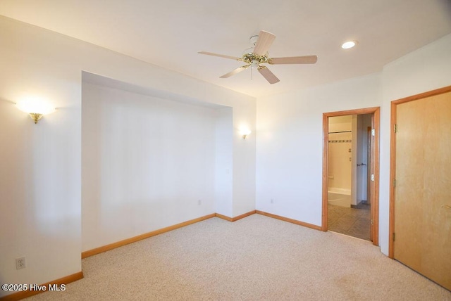 empty room featuring ceiling fan and carpet floors