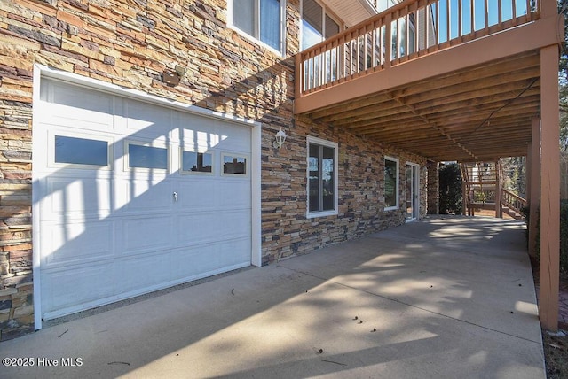 view of patio / terrace featuring a garage