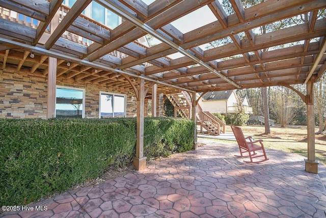 view of patio featuring a pergola