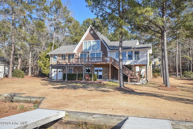 back of property featuring a wooden deck