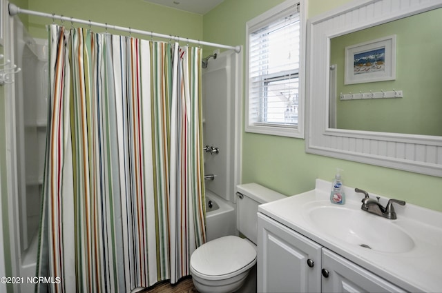 full bathroom with vanity, shower / bath combo, and toilet