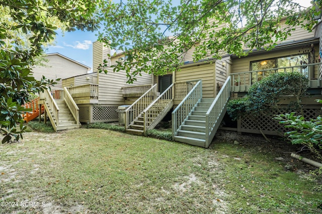 view of yard featuring a deck and stairway