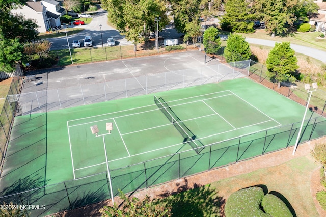 view of sport court with fence