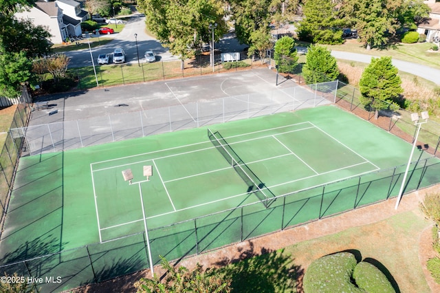 view of tennis court with fence