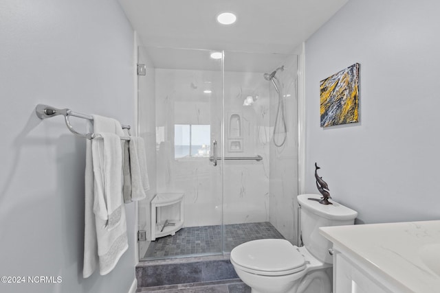 bathroom with vanity, tile patterned floors, toilet, and walk in shower