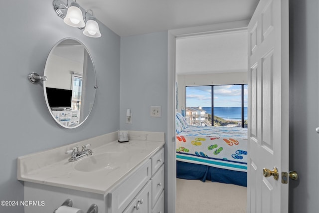 bathroom featuring vanity and a water view