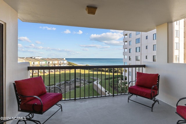 balcony featuring a water view