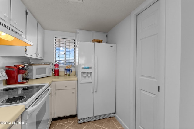 kitchen with white cabinets, a textured ceiling, exhaust hood, and white appliances