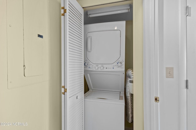 laundry area with stacked washer and dryer