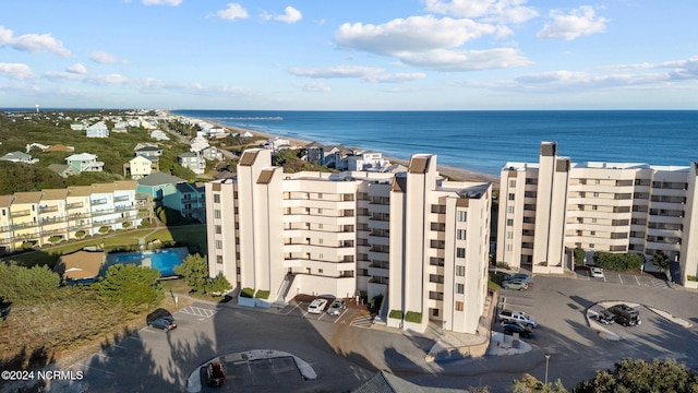 drone / aerial view with a water view and a view of the beach