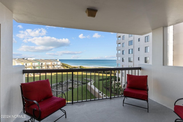 balcony featuring a water view