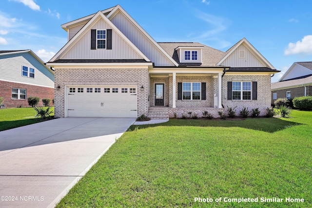 craftsman-style home featuring a front yard and a garage