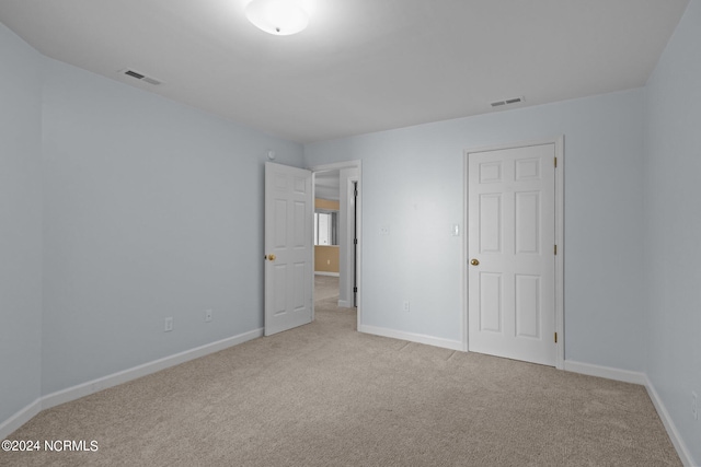 spare room with carpet floors