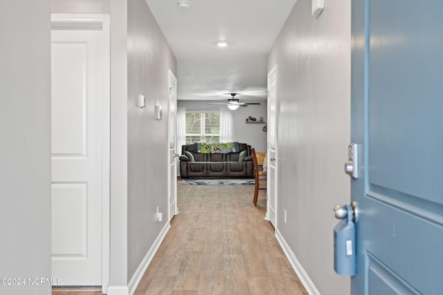 hall with light wood-type flooring