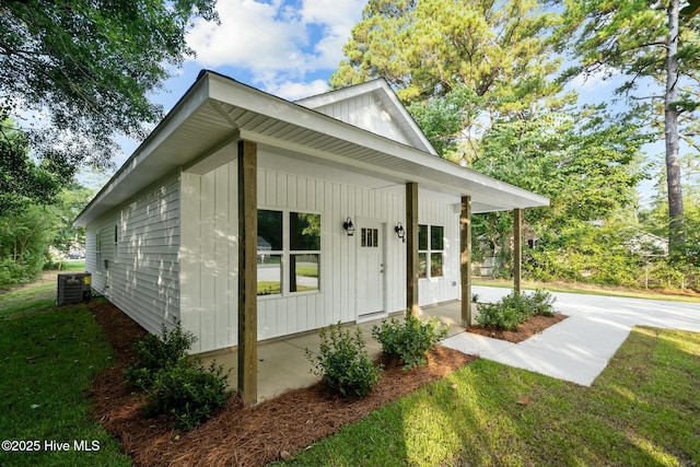 exterior space with a porch and central air condition unit