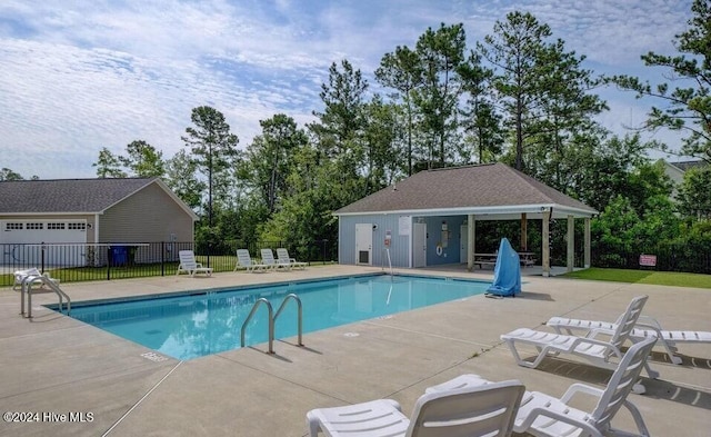 view of swimming pool featuring a patio area