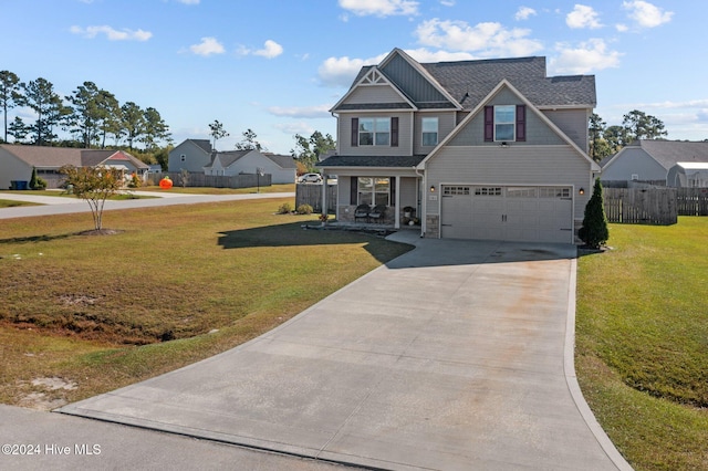 view of front of home featuring a front lawn and a garage