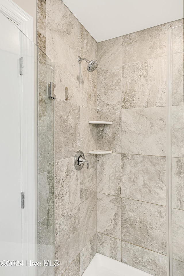 bathroom featuring an enclosed shower