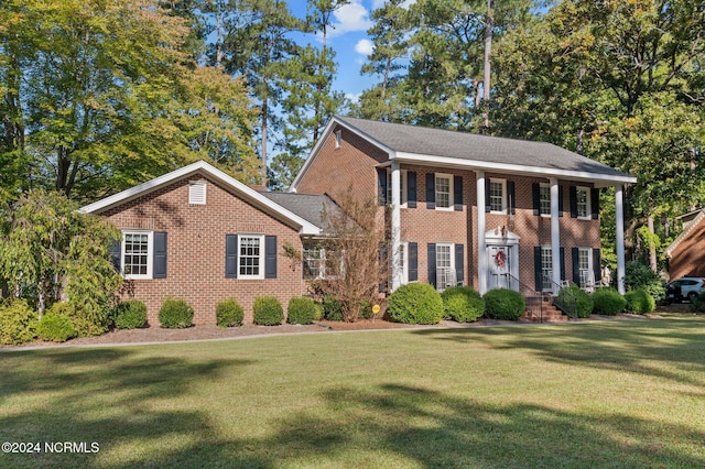 colonial home with a front yard