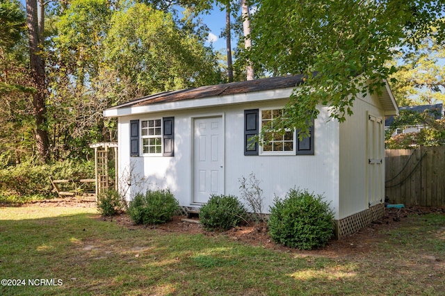 view of outdoor structure with a lawn