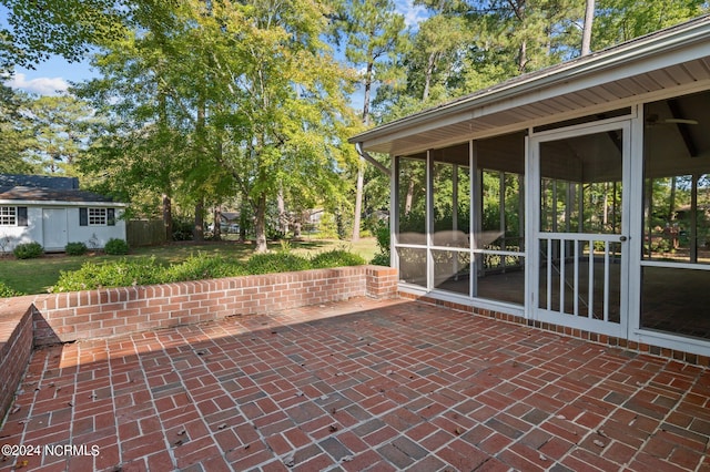 view of patio / terrace with a sunroom