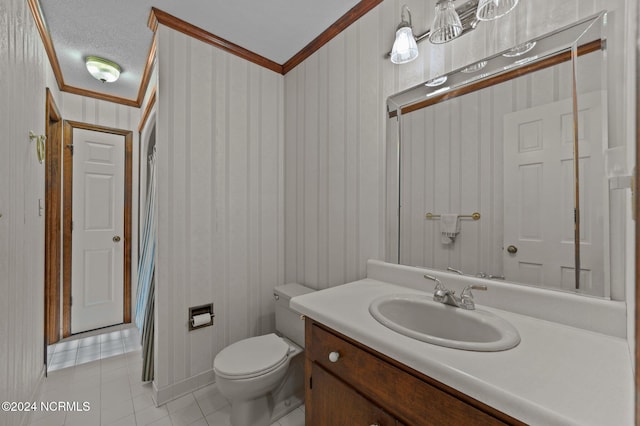 bathroom featuring toilet, tile patterned flooring, crown molding, vanity, and a textured ceiling