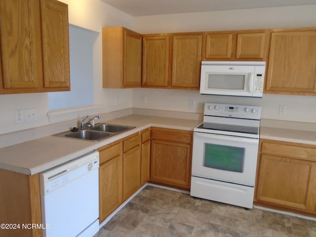 kitchen featuring sink and white appliances