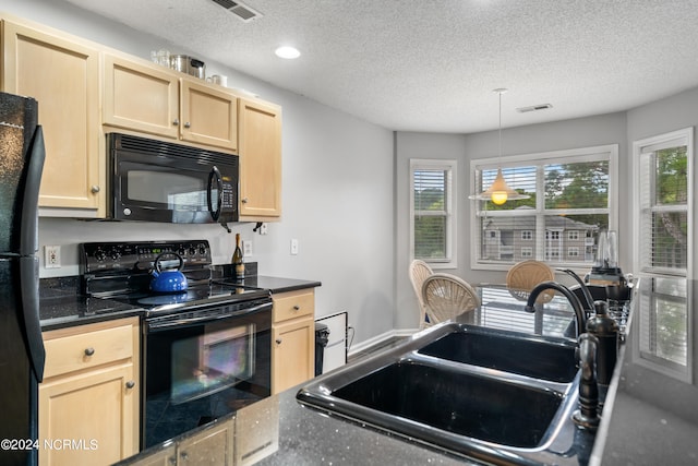 kitchen featuring light brown cabinets, hanging light fixtures, sink, black appliances, and a textured ceiling