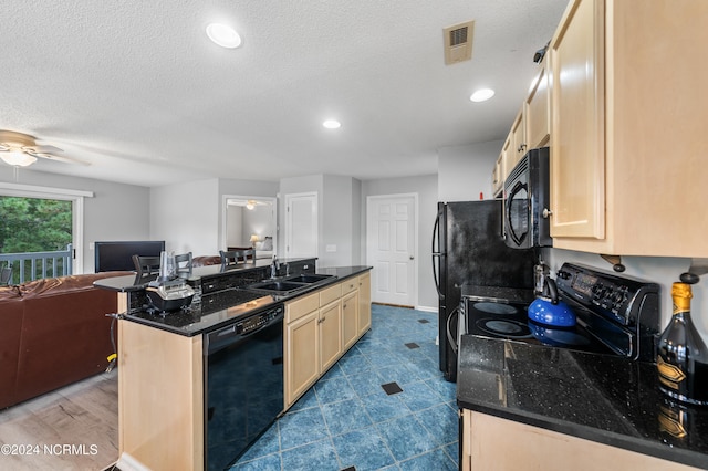 kitchen featuring ceiling fan, a textured ceiling, light wood-type flooring, black appliances, and sink