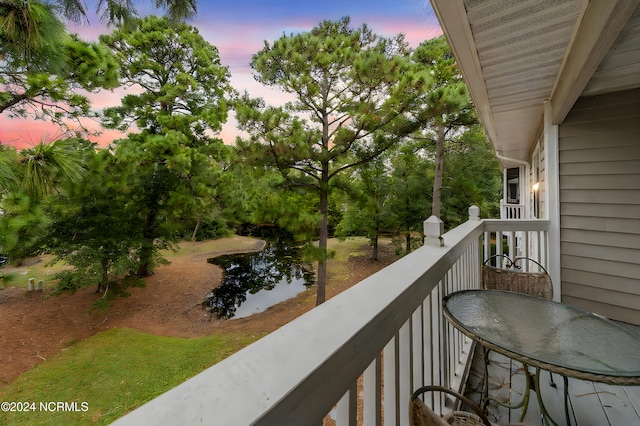 view of balcony at dusk